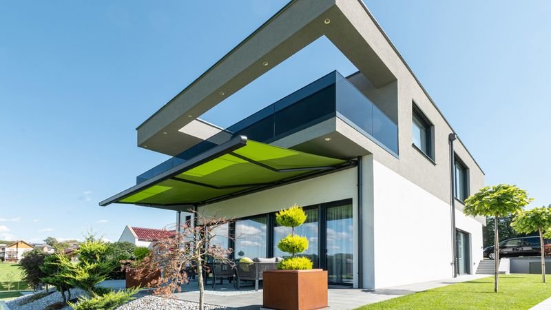 Markilux MX-1 Compact med grønt stof på et moderne designhus